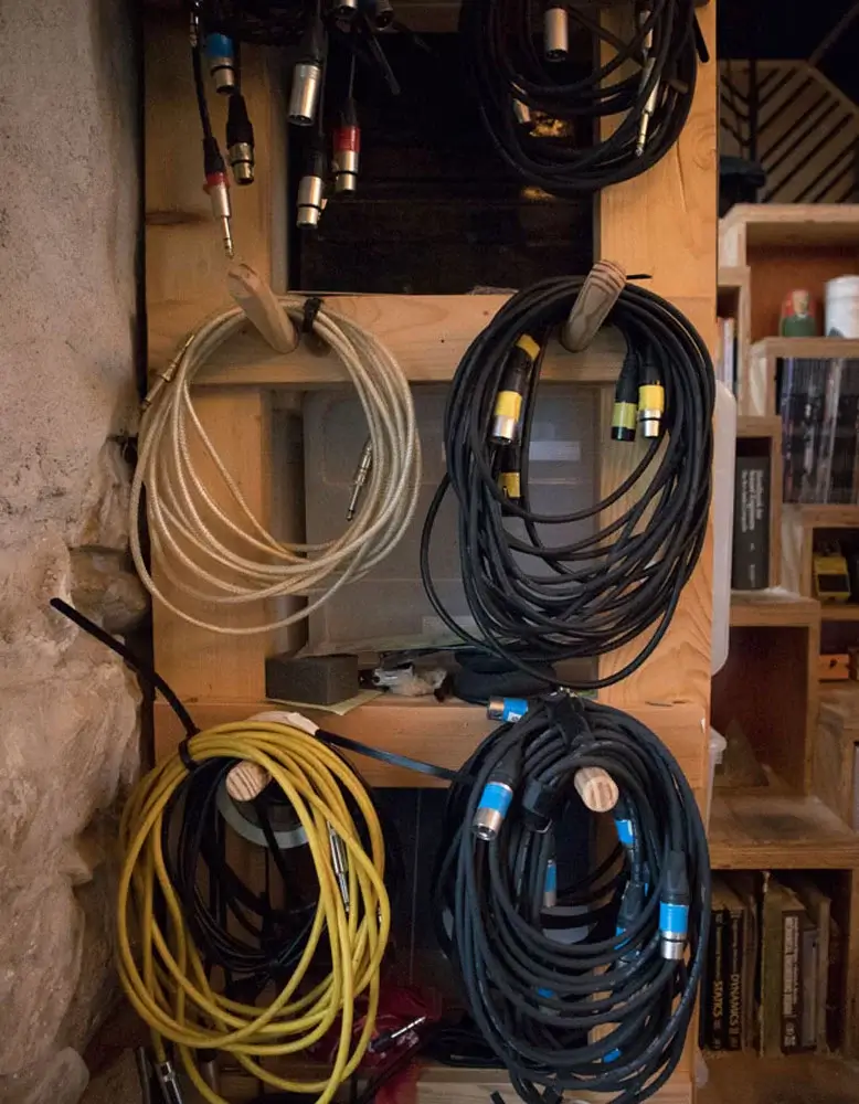 Cables stacked on a wall
