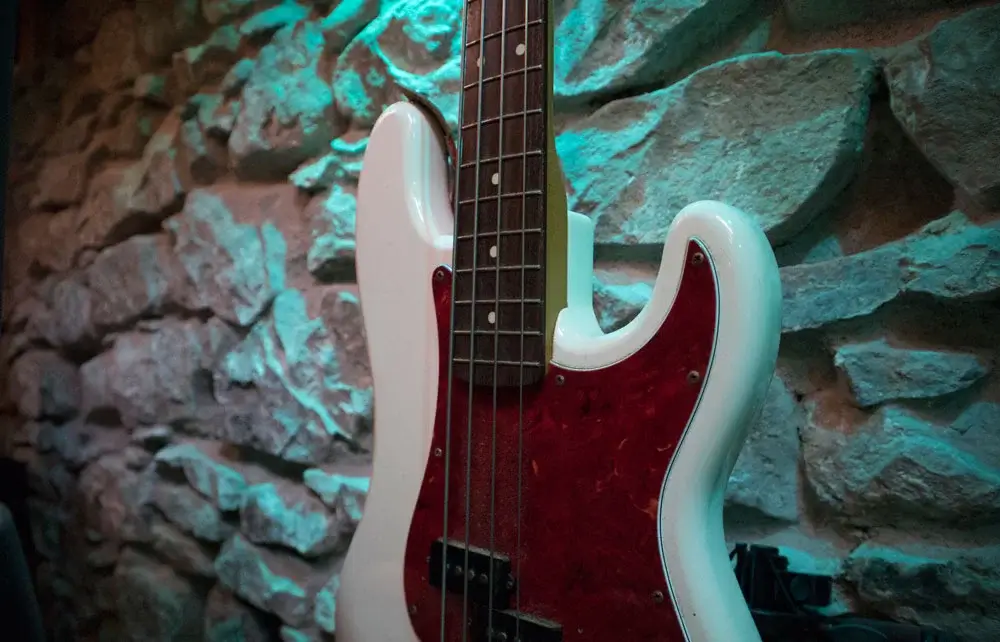 Bass guitar hanging on wall