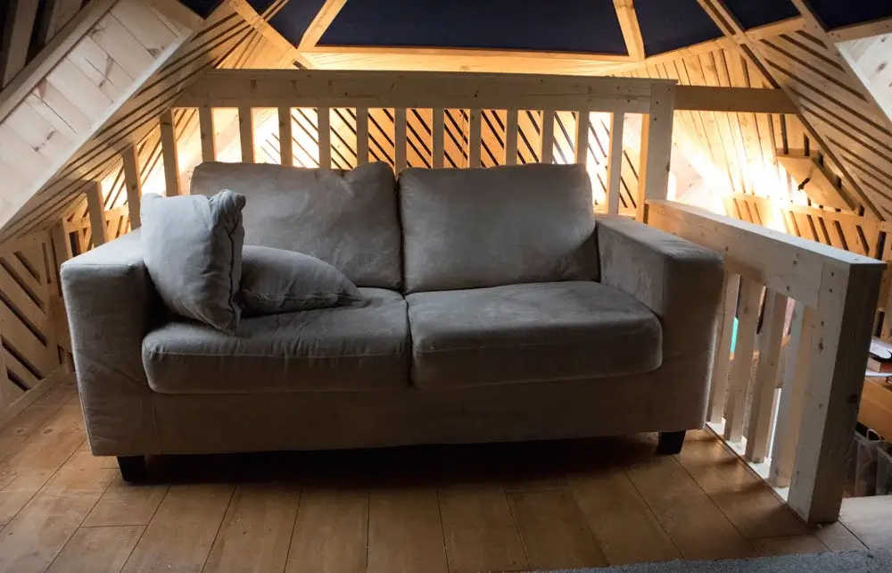 sofa in upstairs area of studio